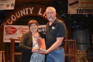 Carla presents award to Michael Stremel